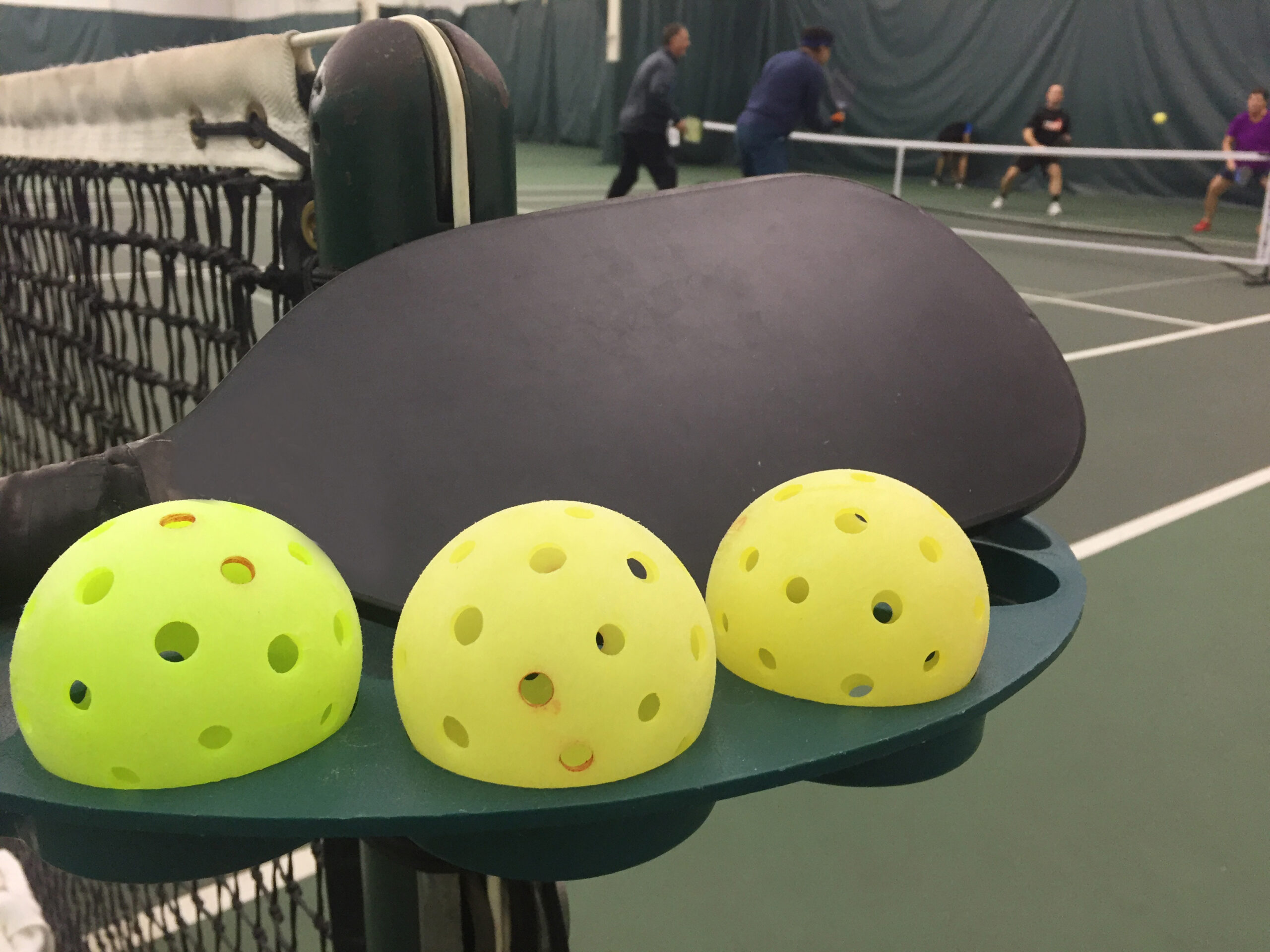 Three,Pickleballs,And,A,Paddle